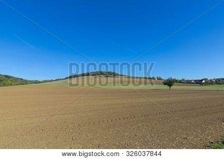 Rural Landscape With New Plowed Fields At The Romantic Street Near Rothenburg Ob Der Tauber, Germany