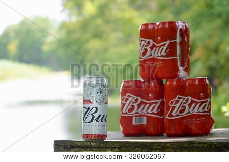Sumy, Ukraine - August 10, 2019: Budweiser Bud Beer Can On Old Wooden Table Outdoors At The River An