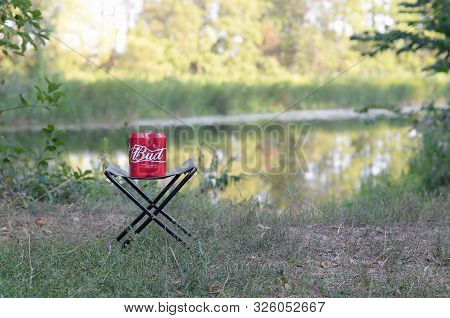 Sumy, Ukraine - August 10, 2019: Budweiser Bud Beer Cans Pack On Folding Chair Outdoors At The River