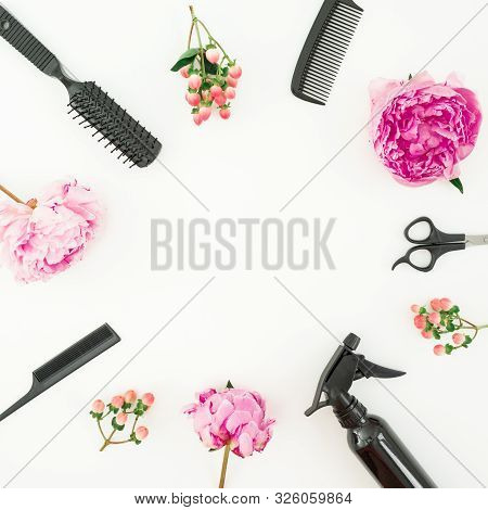 Hairdresser Styler Frame With Spray, Scissors, Combs And Peonies Flowers On White. Flat Lay