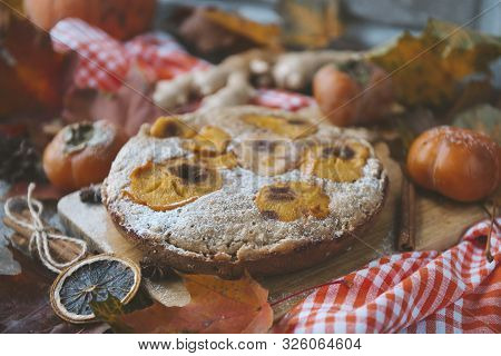 Homemade Cake With Pieces Of Persimmon And Powdered Sugar, Fresh Persimmon, Autumn Fallen  Red Leave
