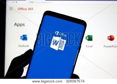 Montreal, Canada - April 24, 2019: A Cell Phone With Microsoft Word Logo Over A Laptop Screen. Micro