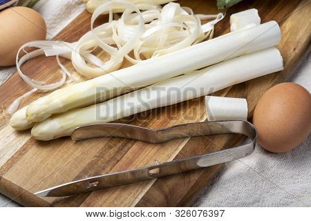 Bunch Of Fresh Uncooked White Asparagus And Peeler Knife, How To Peel Asparagus Vegetables