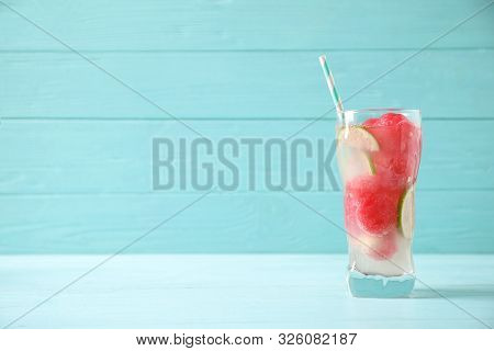 Glass Of Refreshing Watermelon Drink On Blue Wooden Table. Space For Text