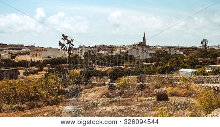 Hill With Terraced Fields For Agriculture And Old Buildings In Ghajnsielem, Gozo Island, Malta