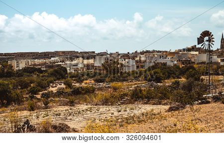 Hill With Terraced Fields For Agriculture And Old Buildings In Ghajnsielem, Gozo Island, Malta