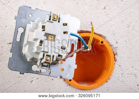 Installation Of The Electric Socket In A Rough Wall. Installation Of A New Electrical Network At Hom