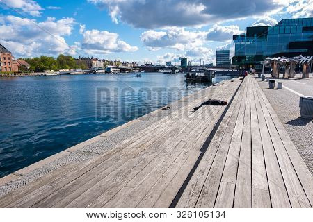 Copenhagen, Denmark - May 04, 2019: People Relax On One Of The Waterfronts Near The Blox - Danish Ar