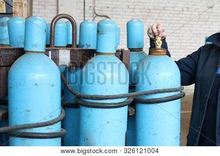 Large Iron Metal Blue Gas Cylinders With Oxygen, Air, Helium Under Excessive Internal Pressure To St