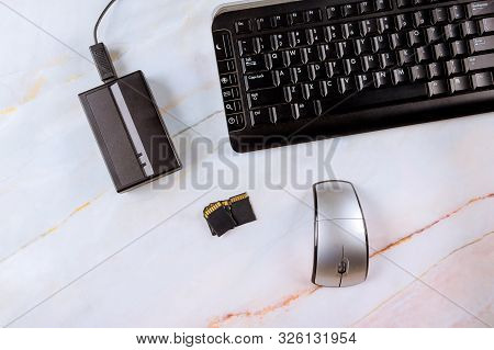 Workplace Photographer Copying Photos From Memory Sd Cards Portable Hard Drive And Laptop Computer