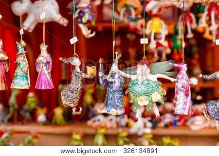 Various fairytale character collectible Christmas baubles for sale at Christmas market (Christkindlmarkt) stall in Central Berlin, Germany