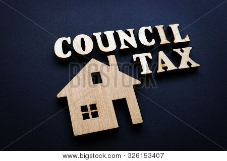 Council Tax And Model Of Home From Wood.