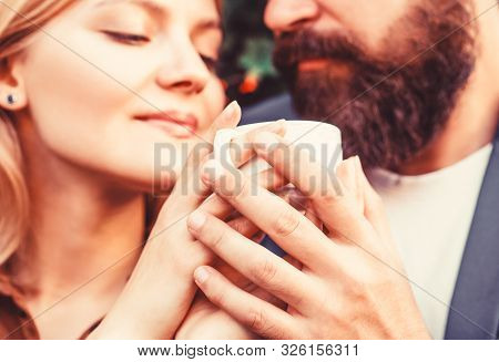 Couple Enjoying Coffe. Female And Man Hands Holding Cup Of Coffee. Couple In Love Holding Hands With
