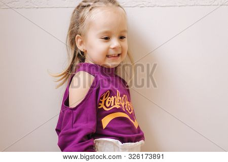 Happy Little Girl Walkning In Toy Store. Cute Girl Choose Toy. Adorable Female In Kids Mall