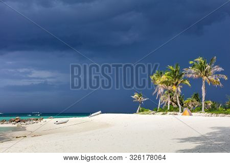 Paradise Beach In Thailand During Storm With Tall Palms