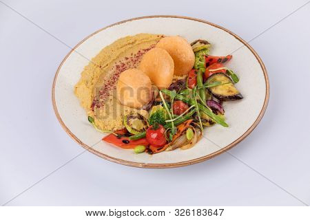 Kyufta Or Barbecue With Snacks Grilled Vegetables, Chips And Hummus.