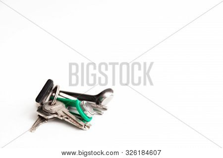 Keys With A Chip Lies On A White Background