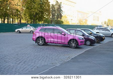Kharkov, Ukraine - September 24, 2019: Volkswagen Touareg Hybrid Nf In Magenta Purple Color On Parki
