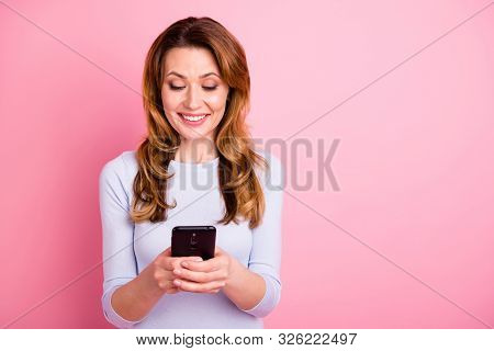 Portrait Of Positive Cheerful Woman Use Her Cellphone Comment Share Blogs Read Feednews Wear White C