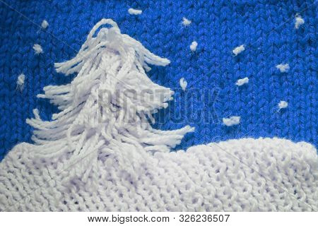 Hadmade Christmas Tree On Blue Knitted Woolen Background With Copy Space For Text Christmas Concept