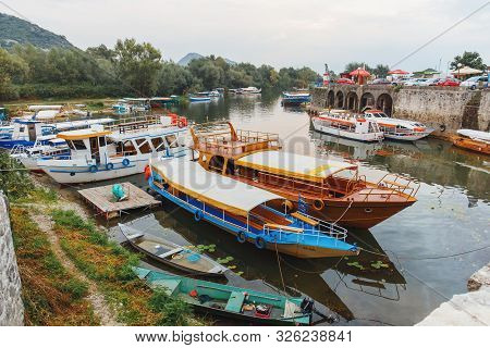 Virpazar, Montenegro - September 11, 2019: Boats For Fishing And Excursions In Harbor. Lake Skadar N