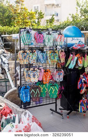 Petrovac, Montenegro - September 17, 2019: Colorful Shoes, Sandles And Flip Flops In Street Market