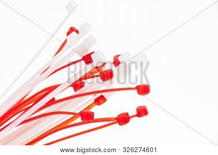 Many Red And White Zip Tie Ties Isolated On White