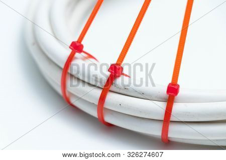 White Cable Wire With Red Zip Tie Ties