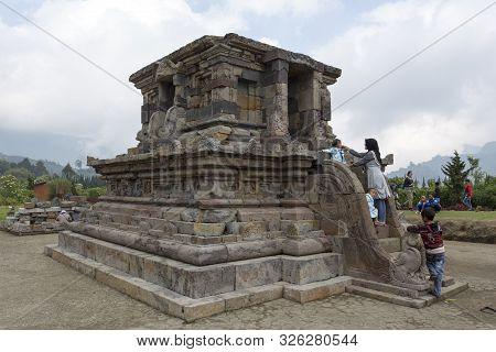 Dieng Plateau, Indonesia - August 06, 2017: People Visiting Ancient Temples At Dieng Plateau, Indone