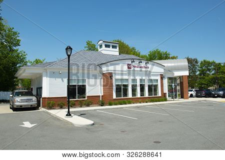 Millis, Ma, Usa - May 10, 2018: Historic Needham Bank On Main Street At The Town Center Of Millis In