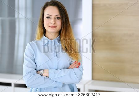 Business Woman Headshot At Workplace In Modern Office. Unknown Businesswoman Standing Straight With 