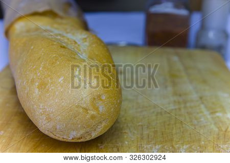Fresh Baguette In A Paper Bag Closeup Copy Space.