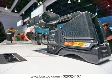 COLOGNE, GERMANY - CIRCA SEPTEMBER, 2018: close up shot of Panasonic FullHD video camera at the Photokina Exhibition. Photokina is a leading trade fair for the worldwide photo industry.