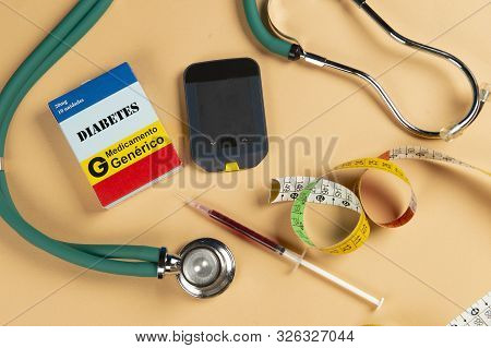 Fake Medicine Box With The Name Of The Disease Diabetes And A Glucometer