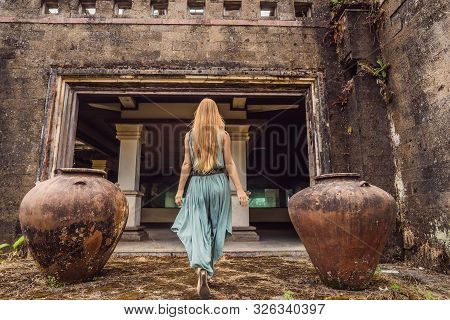 Woman Tourist In Abandoned And Mysterious Hotel In Bedugul. Indonesia, Bali Island. Bali Travel Conc