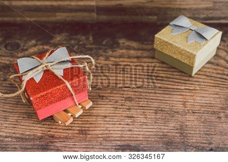 Christmas Present Box With Bow And Glitters, Concept Of Gift Giving And Seasonal Holiday Shopping