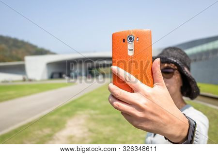 traveling woman selfie at Xiangshan Visitor Center, Sun Moon Lake, Nantou, Taiwan