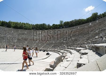 Epidaurus Greece - July 19 2019; Ancient Epidaurus Theatre Stone Seating Rows With Modern Numbers Ad