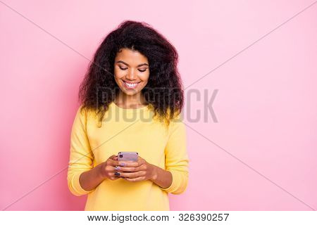 Portrait Of Positive Cheerful Black Lady Feel Interested Use Her Cell Phone Read Feednews In Social 