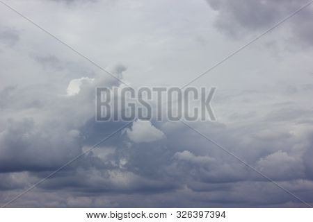 Dark Heavy Clouds. Rain Clouds. Time Before The Rain. There Are Bright Gaps Behind The Clouds. Backg