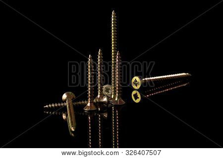 Group Of Eight Whole Metallic Glossy Bolt Isolated On Black Glass