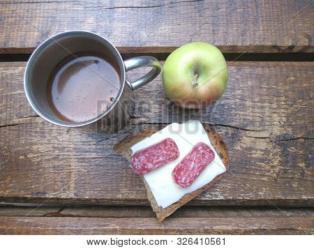 Coffee In Steel Thermo Mug, Sandwich And Apple On Wooden Table. Outdoor Morninig Meal, Breakfast Or 