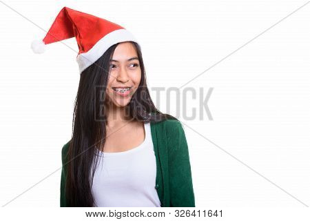 Thoughtful Young Happy Asian Teenage Girl Smiling Ready For Chri