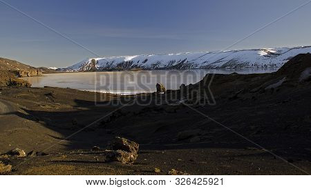 The Winter Colours Of Beautiful Kerio, Or Kerid Crater In Western Iceland. Red Volcanic Rock