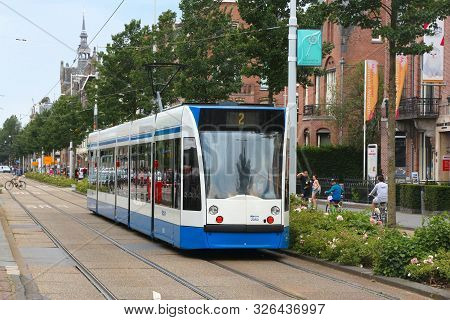 Amsterdam, Netherlands - July 10, 2017: People Ride The Gvb Electric Tram (combino Model Made By Sie