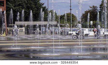 Geneva, Switzerland - September 22 2019:  The Water Fountains And Landmark Broken Chair Sculpture At
