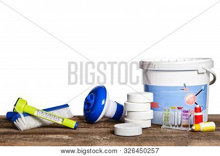 Equipment With Chemical Cleaning Products And Tools For The Maintenance Of The Swimming Pool On A Wo