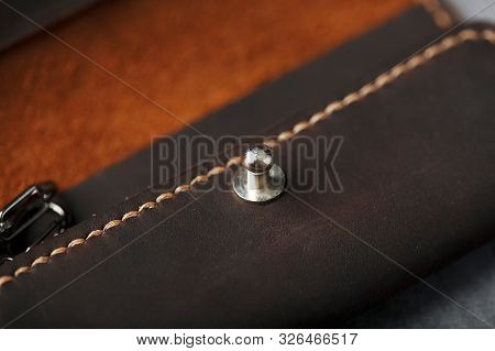 Wallet Keymaster Made Of Brown Genuine Leather, Handmade On A Dark Background