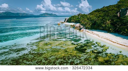 Aerial Panoramic View Of Anse Source Dargent Beach At La Digue Island, Seychelles In The Morning Lig