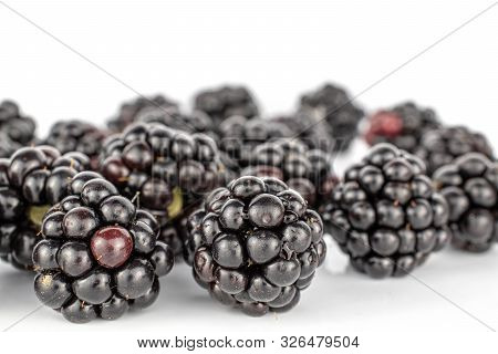 Lot Of Whole Arranged Fresh Black Blackberry Isolated On White Background